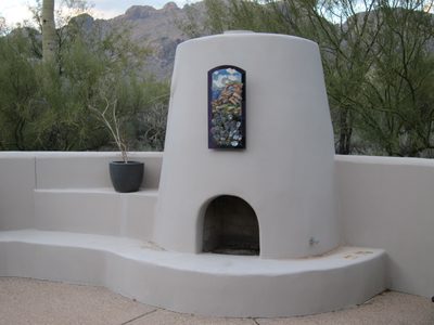 New art work over the kiva; echoes the scene behind it