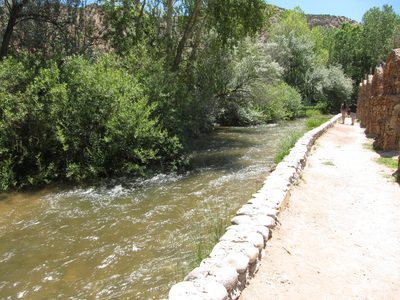Stream rushing along the chapel site.  Folks from Tucson...
