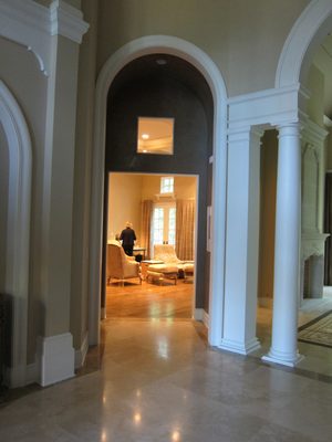 To left of living room arch is smaller arch leading into...