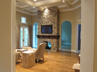 View from the kitchen of the family room.  The arches on...