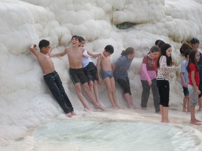 These kids don't have socks on, and seem to be natives.