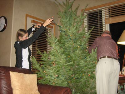 Catherine and Dad putting lights on our awesomely green ...