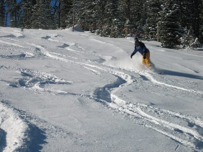 Catherine toe side on the aptly named Powder River trail.