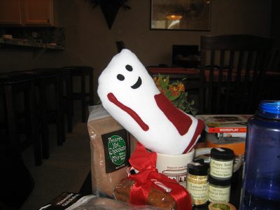 Bacon-y sits among some of Catherine's stocking stuffers...