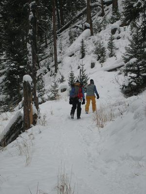 Catherine and Dad tromping to Ousel Falls.