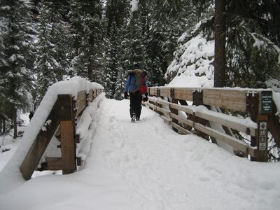 Dad walking across a bridge over the South Fork of the...