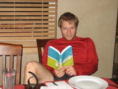 John reads his waterproof book before dinner.  He's...