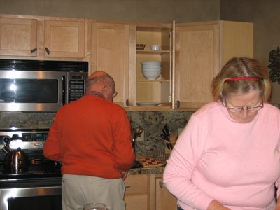 Mom and Dad put the finishing touches on dinner Christmas night.