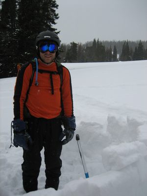 John, standing inside the igloo (under construction).