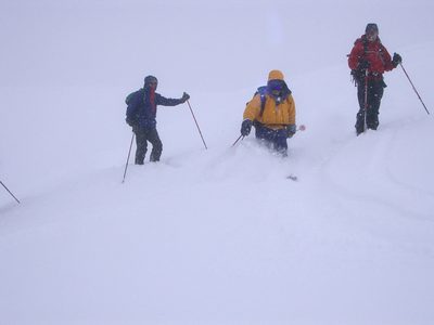John (Jim to right Allen possibly to left) skiing some...
