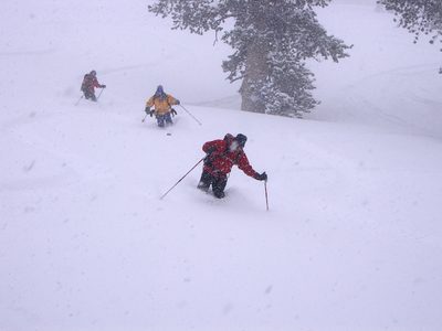John skiing, in the middle-ground (yellow jacket).