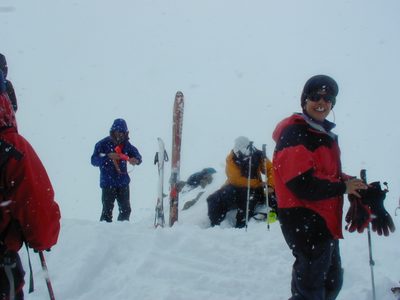 Cathy, prepping her gear for downhill mode at the summit...