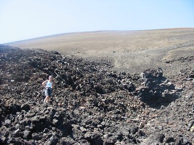 Rachel boulder-hopping in the fantastic lava beds.