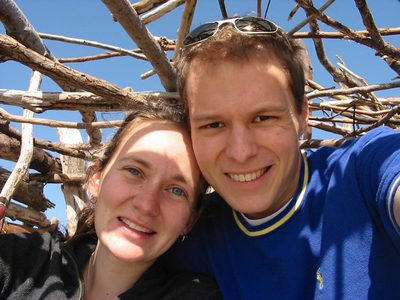 Rachel and John self-portrait in a driftwood lean-to on...