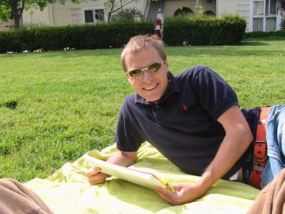 John doing some school reading in the sun outside...