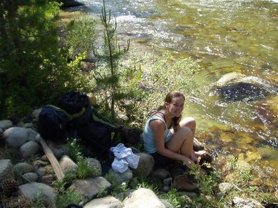 Rachel drying our feet after our river crossing.